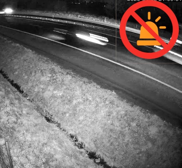 Night frame of a vehicle bordering on recognition due to speed and blur